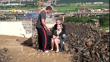 Young blonde little hottie is fucked in public sex construction site threesome